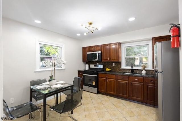 1190 Union St, Linden City, NJ 07036 - kitchen with appliances with stainless steel finishes, a sink, plenty of natural light, backsplash, and recessed lighting