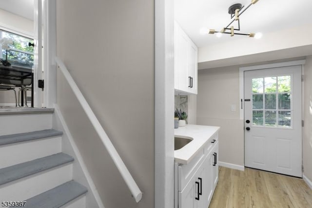 1190 Union St, Linden City, NJ 07036 - stairs featuring a chandelier and wood finished floors