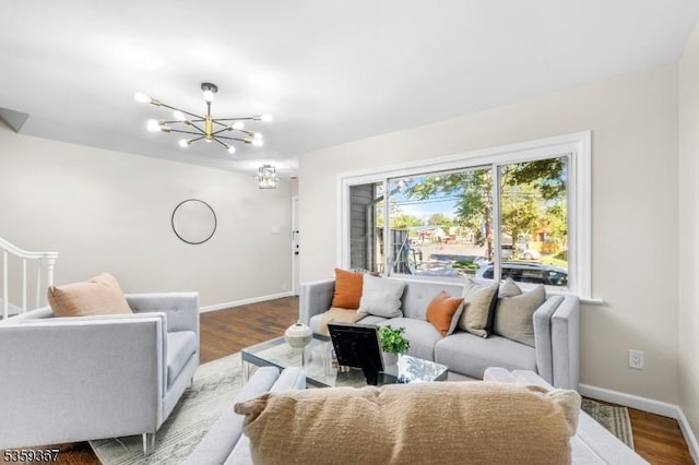 1190 Union St, Linden City, NJ 07036 - living room with a chandelier, baseboards, and wood finished floors