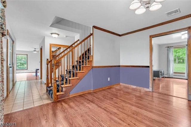 1 Lepont St, Stanhope Boro, NJ 07874 - stairs with wood finished floors, healthy amount of natural light, a chandelier, and ornamental molding