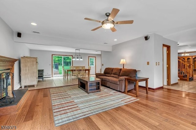 1 Lepont St, Stanhope Boro, NJ 07874 - living room featuring a ceiling fan, light wood-style flooring, recessed lighting, stairs, and a chandelier