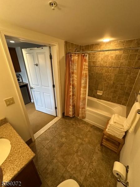 200 State Rt 94 Unit 259, Vernon Twp, NJ 07462 - full bath featuring vanity, shower / tub combo with curtain, and tile patterned floors