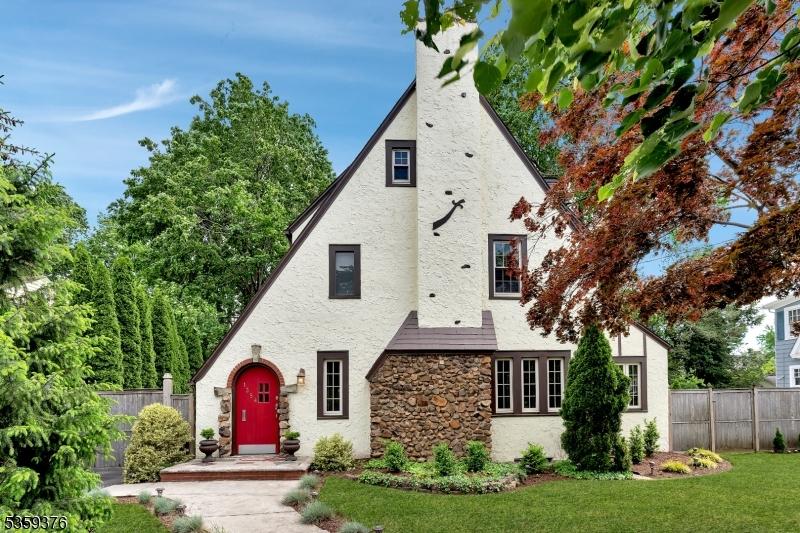 1354 Chetwynd Ave, Plainfield City, NJ 07060 - tudor-style house with stone siding, a chimney, and stucco siding