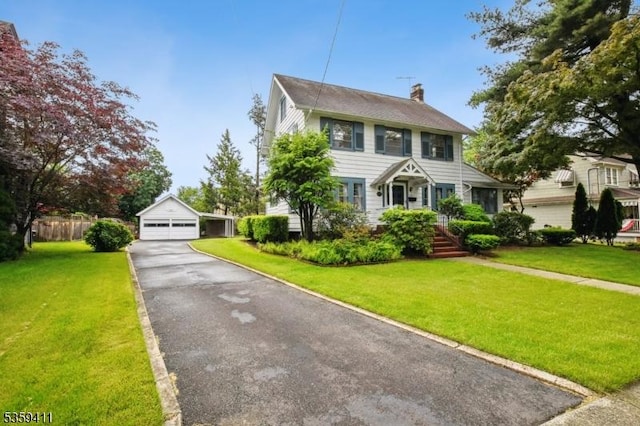 129 Severin Ct, Cranford Twp, NJ 07016 - colonial-style house featuring a chimney, a garage, a front lawn, and an outdoor structure