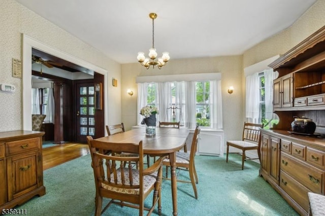 129 Severin Ct, Cranford Twp, NJ 07016 - carpeted dining space with a chandelier