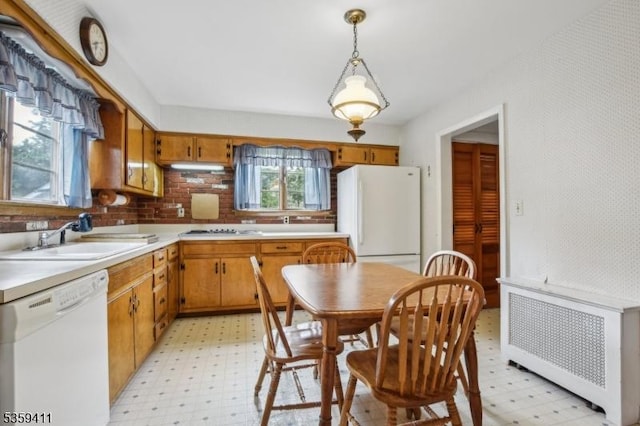 129 Severin Ct, Cranford Twp, NJ 07016 - kitchen featuring white appliances, radiator heating unit, a sink, and light floors