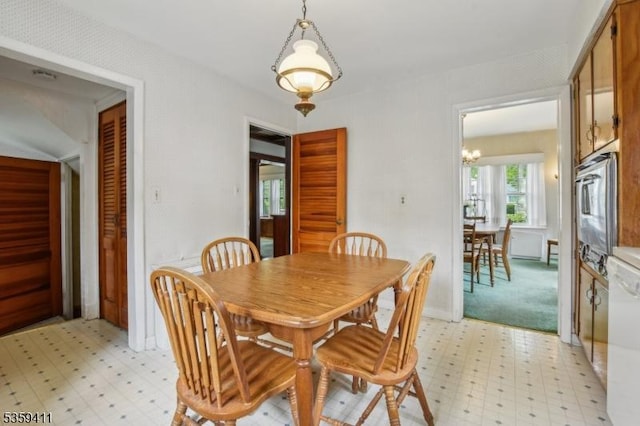 129 Severin Ct, Cranford Twp, NJ 07016 - dining area featuring light floors, a chandelier, and baseboards