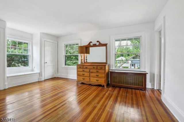 129 Severin Ct, Cranford Twp, NJ 07016 - unfurnished room featuring radiator, hardwood / wood-style floors, healthy amount of natural light, and baseboards