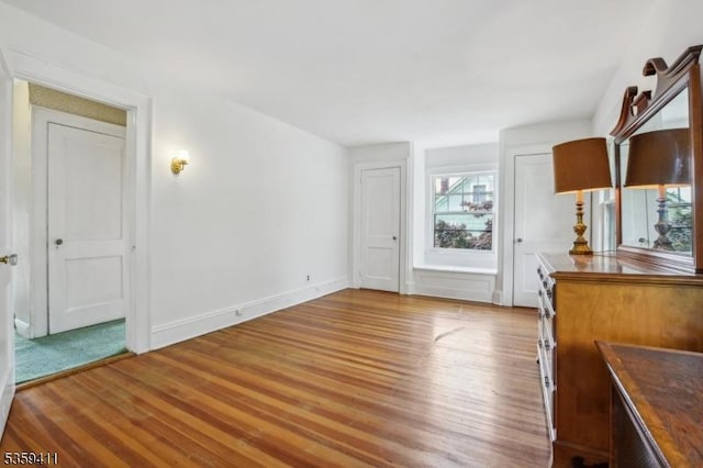 129 Severin Ct, Cranford Twp, NJ 07016 - unfurnished dining area featuring wood finished floors and baseboards