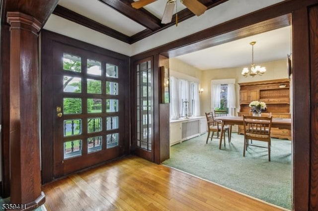 129 Severin Ct, Cranford Twp, NJ 07016 - foyer entrance featuring healthy amount of natural light, a chandelier, ceiling fan, light wood-type flooring, and beamed ceiling