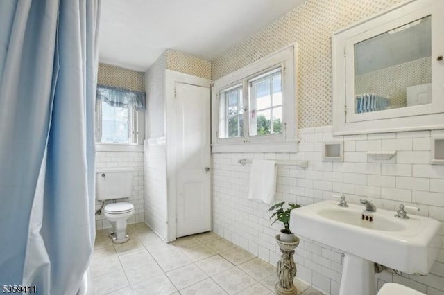 129 Severin Ct, Cranford Twp, NJ 07016 - bathroom with tile walls, toilet, tile patterned flooring, plenty of natural light, and wallpapered walls