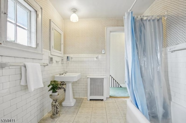 129 Severin Ct, Cranford Twp, NJ 07016 - bathroom with tile patterned flooring, shower / tub combo with curtain, wallpapered walls, a sink, and tile walls