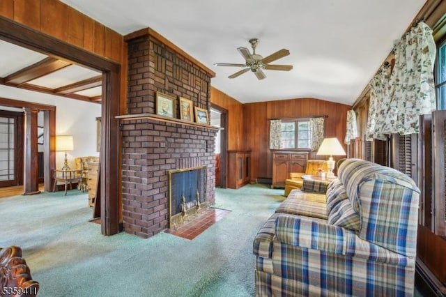 129 Severin Ct, Cranford Twp, NJ 07016 - carpeted living area with vaulted ceiling, a ceiling fan, a brick fireplace, and wooden walls