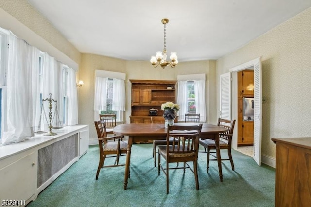 129 Severin Ct, Cranford Twp, NJ 07016 - dining space with carpet, a chandelier, and baseboards