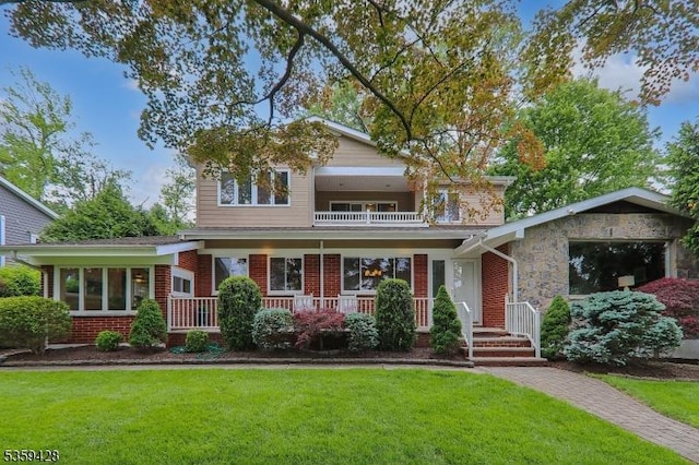 103 County Park Dr, Cranford Twp, NJ 07016 - view of front of home featuring a balcony, a front yard, covered porch, and brick siding