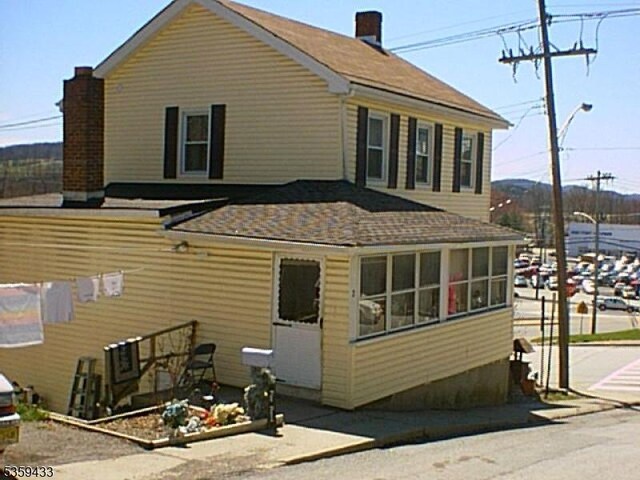 2-8 Harrison St, Sussex Boro, NJ 07461 - rear view of property featuring a chimney and a shingled roof