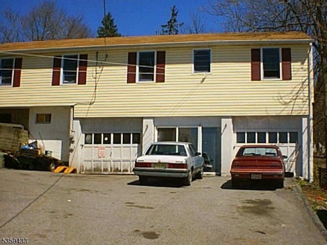 2-8 Harrison St, Sussex Boro, NJ 07461 - view of front of house with a garage and asphalt driveway