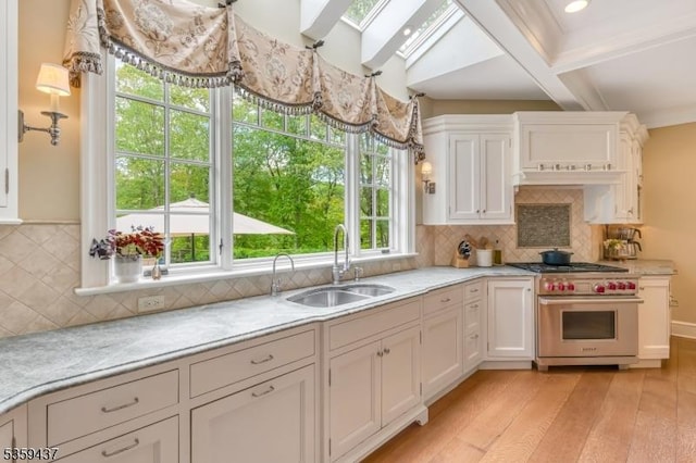 259 Indian Trail Dr, Franklin Lakes Boro, NJ 07417 - kitchen with luxury stove, a sink, light countertops, white cabinets, and beamed ceiling