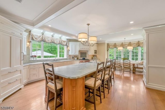 259 Indian Trail Dr, Franklin Lakes Boro, NJ 07417 - kitchen with a sink, plenty of natural light, light wood finished floors, recessed lighting, and ornamental molding
