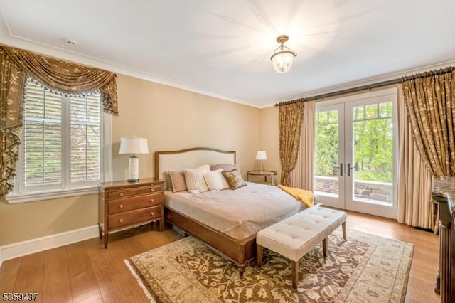 259 Indian Trail Dr, Franklin Lakes Boro, NJ 07417 - bedroom featuring french doors, access to exterior, crown molding, light wood-style flooring, and baseboards