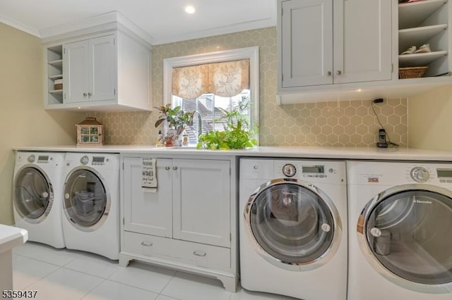 259 Indian Trail Dr, Franklin Lakes Boro, NJ 07417 - washroom with washer and dryer, ornamental molding, light tile patterned floors, and cabinet space
