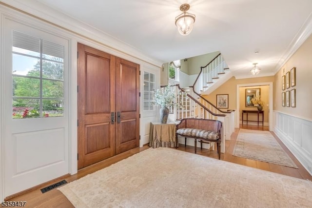 259 Indian Trail Dr, Franklin Lakes Boro, NJ 07417 - entryway featuring wood finished floors, stairs, and crown molding