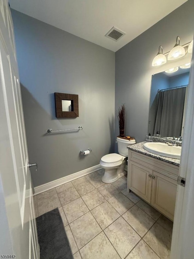 7400 River Rd Unit 437, North Bergen Twp, NJ 07047 - bathroom featuring toilet, vanity, tile patterned flooring, and baseboards