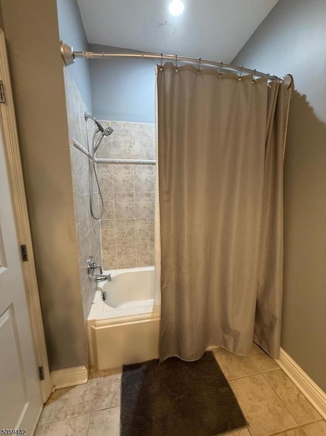 7400 River Rd Unit 437, North Bergen Twp, NJ 07047 - full bathroom featuring tile patterned floors, shower / bath combo, and baseboards