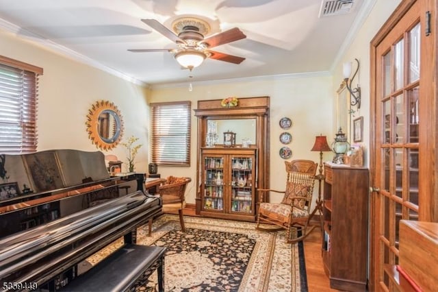 947 Madison Ave, Plainfield City, NJ 07060 - sitting room with a ceiling fan, wood finished floors, and crown molding
