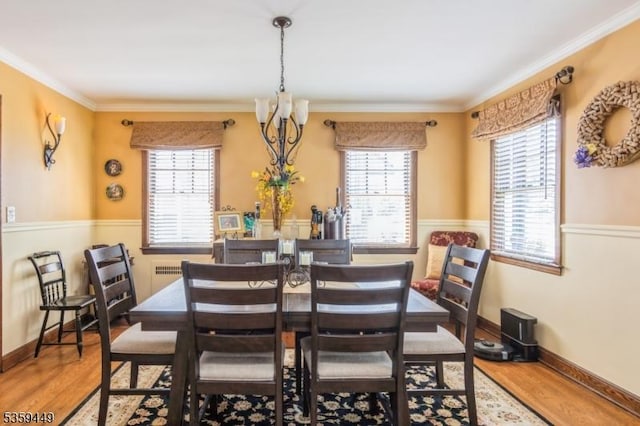 947 Madison Ave, Plainfield City, NJ 07060 - dining room featuring wood finished floors, healthy amount of natural light, crown molding, and baseboards