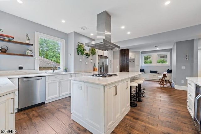 296 Highfield Ln, Nutley Twp, NJ 07110 - kitchen featuring island exhaust hood, appliances with stainless steel finishes, a sink, white cabinetry, and dark wood-style flooring
