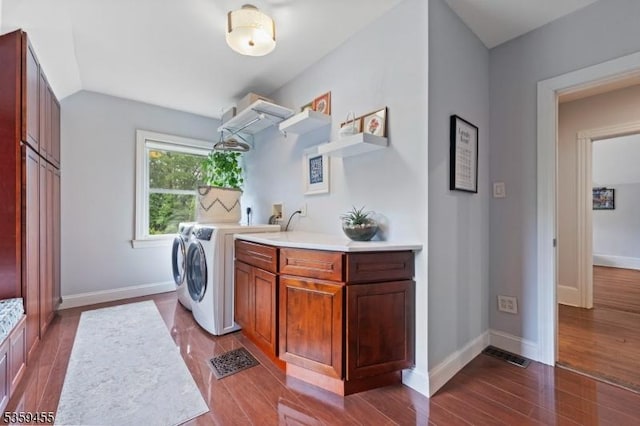 296 Highfield Ln, Nutley Twp, NJ 07110 - laundry area featuring washing machine and clothes dryer, cabinet space, dark wood-style flooring, and baseboards