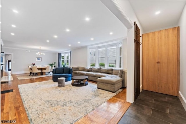 296 Highfield Ln, Nutley Twp, NJ 07110 - living room featuring wood finished floors, recessed lighting, baseboards, a chandelier, and crown molding