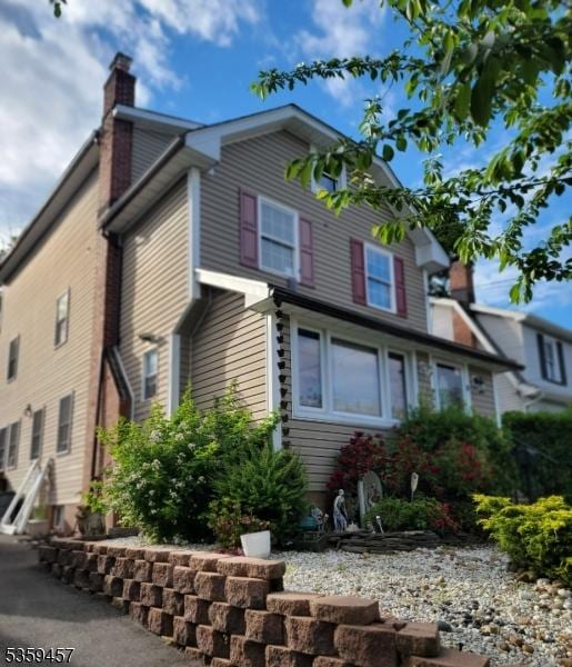 31 Mertz Ave, Belleville Twp, NJ 07109 - view of side of home with a chimney