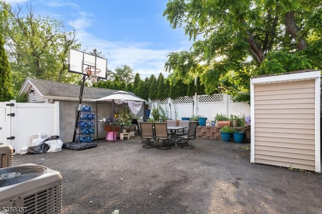 31 Mertz Ave, Belleville Twp, NJ 07109 - fenced backyard featuring outdoor dining space, a patio, and an outdoor structure