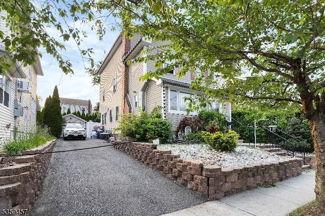 31 Mertz Ave, Belleville Twp, NJ 07109 - view of side of home featuring driveway and a garage