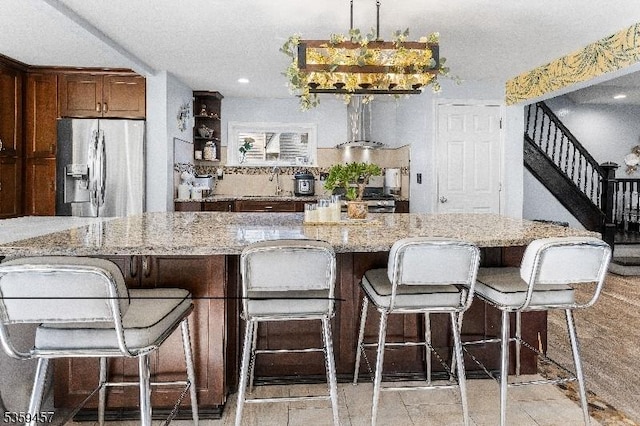 31 Mertz Ave, Belleville Twp, NJ 07109 - kitchen with stainless steel appliances, exhaust hood, light stone countertops, a kitchen breakfast bar, and recessed lighting