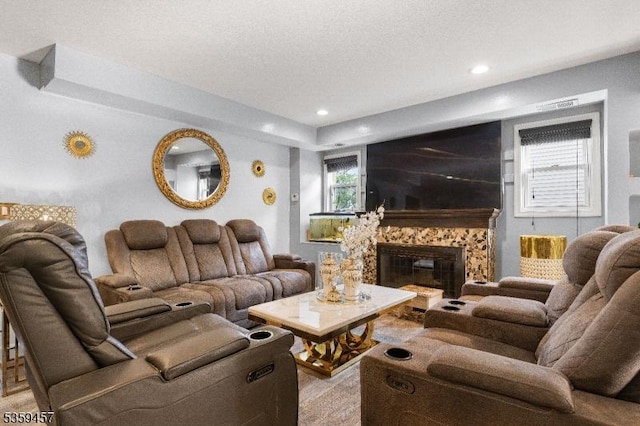 31 Mertz Ave, Belleville Twp, NJ 07109 - living room featuring a glass covered fireplace, a textured ceiling, and recessed lighting