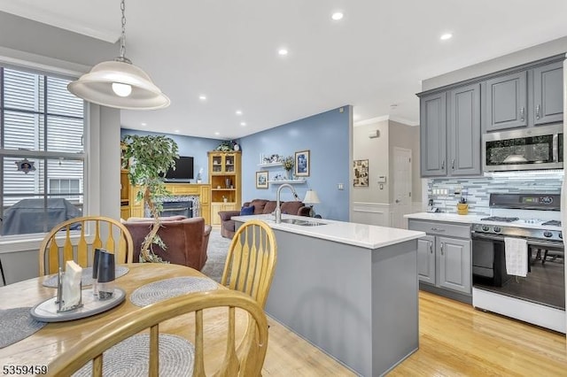 5 Ten Broek Ct, Bridgewater Twp, NJ 08807 - kitchen with stainless steel microwave, white gas range, gray cabinets, a sink, and light countertops