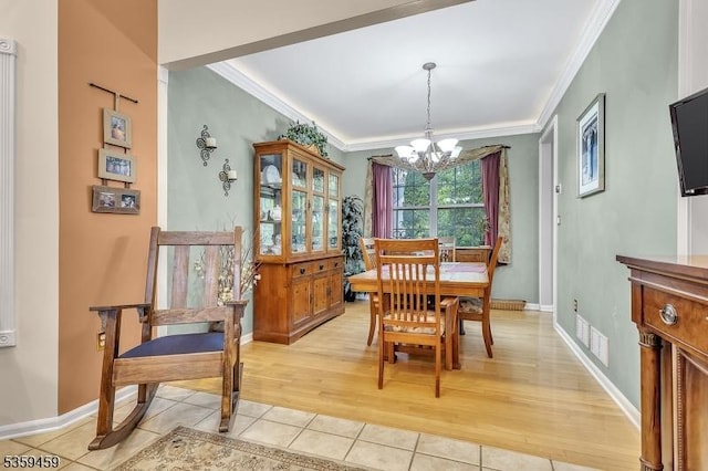 5 Ten Broek Ct, Bridgewater Twp, NJ 08807 - dining area featuring crown molding, a chandelier, light tile patterned floors, and baseboards