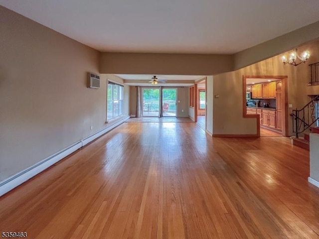 5461 Berkshire Valley Rd, Jefferson Twp, NJ 07438 - unfurnished living room featuring stairs, light wood finished floors, a chandelier, a wall mounted AC, and baseboards