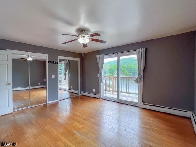 5461 Berkshire Valley Rd, Jefferson Twp, NJ 07438 - unfurnished room with baseboard heating, a ceiling fan, and wood finished floors