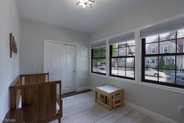 228 78th St, North Bergen Twp, NJ 07047 - bedroom featuring multiple windows, baseboards, and a closet