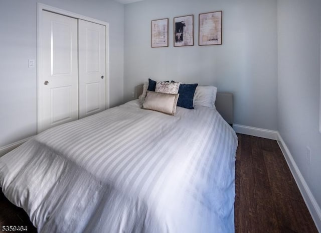 228 78th St, North Bergen Twp, NJ 07047 - bedroom featuring baseboards, wood finished floors, and a closet