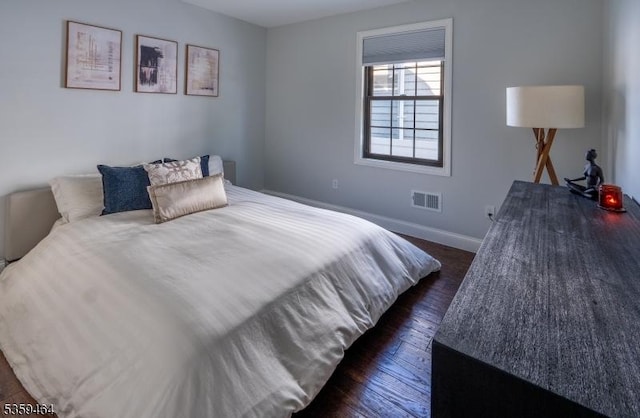 228 78th St, North Bergen Twp, NJ 07047 - bedroom with dark wood finished floors and baseboards