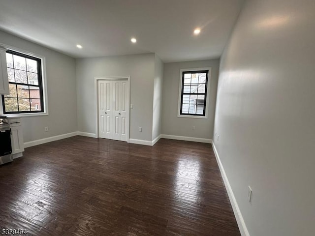 228 78th St, North Bergen Twp, NJ 07047 - unfurnished living room featuring dark wood finished floors, recessed lighting, and baseboards