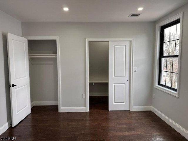 228 78th St, North Bergen Twp, NJ 07047 - unfurnished bedroom featuring wood finished floors, multiple closets, baseboards, and recessed lighting