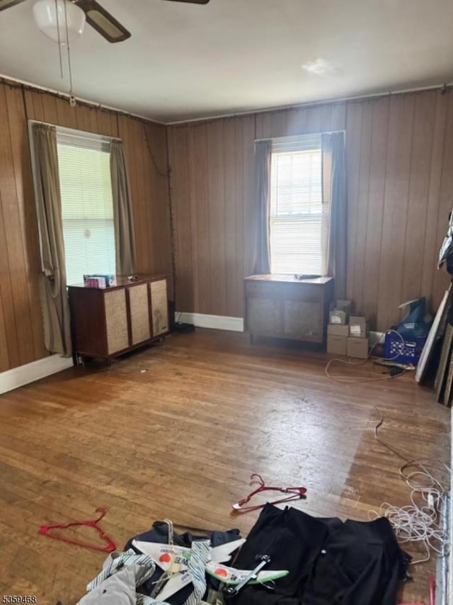 1632 Willever St, Plainfield City, NJ 07063 - spare room featuring ceiling fan, healthy amount of natural light, wood finished floors, baseboards, and wood walls