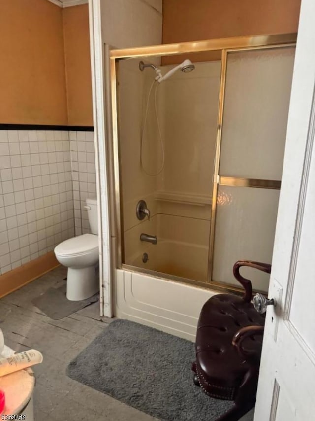 1632 Willever St, Plainfield City, NJ 07063 - bathroom featuring toilet, tile walls, and bath / shower combo with glass door