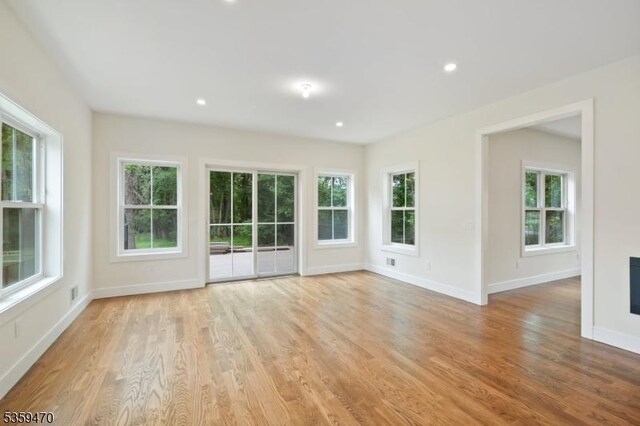 1 Willow Pl, East Hanover Twp, NJ 07936 - unfurnished room with plenty of natural light, light wood finished floors, baseboards, and recessed lighting